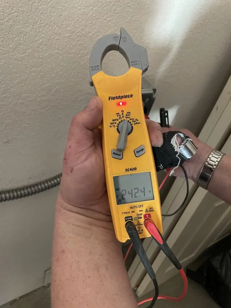 Voltage testing with clamp meter during Recessed Lighting Installation in Sheffield Lake